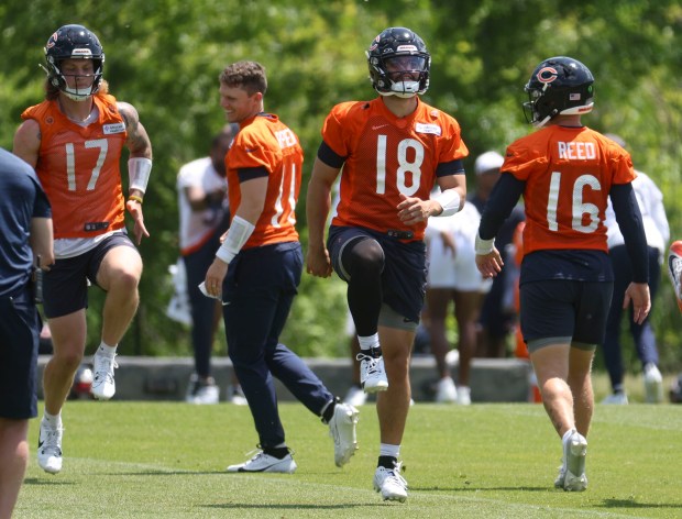 Chicago Bears quarterback Caleb Williams (18) works out with other quarterbacks Thursday, May 23, 2024, during OTAs at Halas Hall. (Brian Cassella/Chicago Tribune)