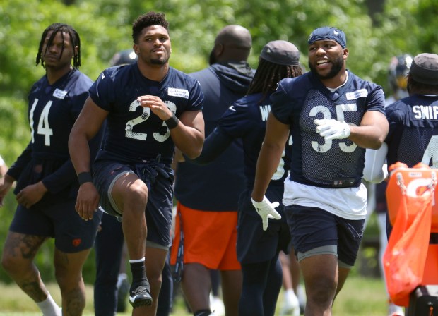 Chicago Bears running back Roschon Johnson (23) and fullback Khari Blasingame (35) work out Thursday, May 23, 2024, during OTAs at Halas Hall. (Brian Cassella/Chicago Tribune)