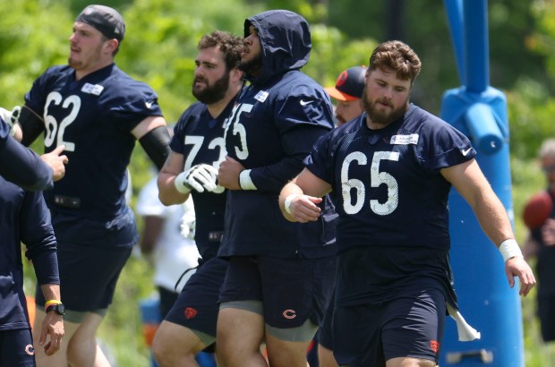 Chicago Bears offensive lineman Coleman Shelton (65) works out Thursday, May 23, 2024, during OTAs at Halas Hall. (Brian Cassella/Chicago Tribune)