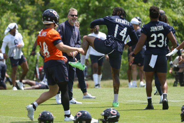 Chicago Bears head coach Matt Eberflus laughs with tight end Gerald Everett (14) on Thursday, May 23, 2024, during OTAs at Halas Hall. (Brian Cassella/Chicago Tribune)