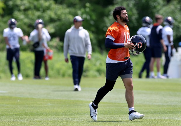 Chicago Bears quarterback Caleb Williams (18) walks on the field during Organized Team Activities at Halas Hall in Lake Forest on Friday, May 31, 2024. (Chris Sweda/Chicago Tribune)