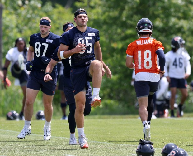 Chicago Bears tight end Brenden Bates (87), tight end Cole Kmet (85), and quarterback Caleb Williams (18), participate in Organized Team Activities at Halas Hall in Lake Forest on Friday, May 31, 2024. (Chris Sweda/Chicago Tribune)