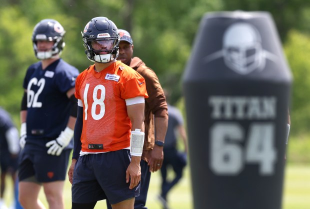 Chicago Bears quarterback Caleb Williams (18) stands on a practice field as players participate in Organized Team Activities at Halas Hall in Lake Forest on Friday, May 31, 2024. (Chris Sweda/Chicago Tribune)