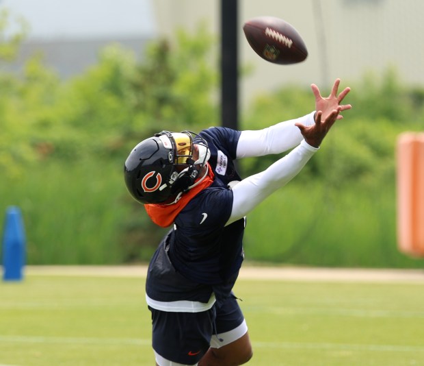 Chicago Bears wide receiver DJ Moore (2) catches an overthrown pass during minicamp at Halas Hall on June 4, 2024, in Lake Forest. (Stacey Wescott/Chicago Tribune)