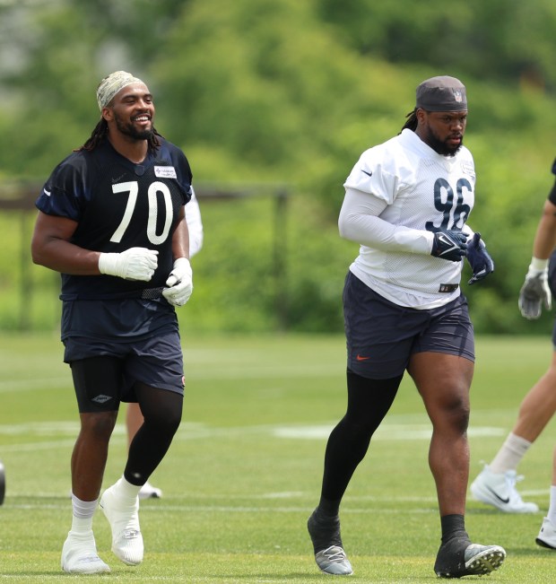 Chicago Bears offensive tackle Braxton Jones (70) and Chicago Bears defensive tackle Zacch Pickens (96) during minicamp at Halas Hall on June 4, 2024, in Lake Forest. (Stacey Wescott/Chicago Tribune)