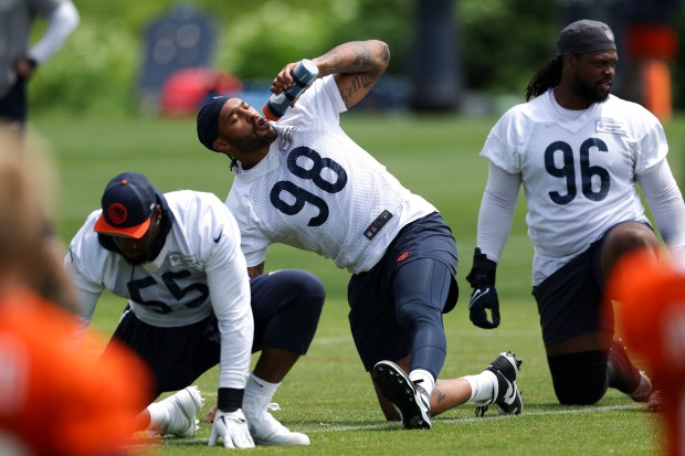 Chicago Bears defensive end Montez Sweat (98) drinks water while he stretches during minicamp at Halas Hall in Lake Forest on June 5, 2024. (Eileen T. Meslar/Chicago Tribune)