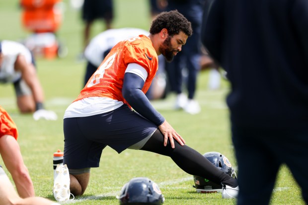 Chicago Bears quarterback Caleb Williams (18) stretches during minicamp at Halas Hall in Lake Forest on June 5, 2024. (Eileen T. Meslar/Chicago Tribune)