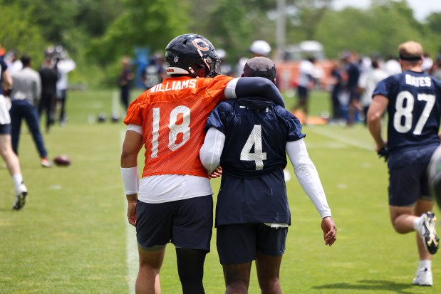 Chicago Bears quarterback Caleb Williams (18) puts his arm around Chicago Bears running back D'Andre Swift (4) during minicamp at Halas Hall in Lake Forest on June 5, 2024. (Eileen T. Meslar/Chicago Tribune)