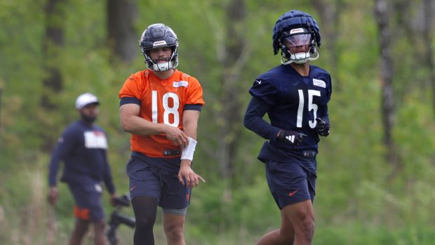 Bears quarterback Caleb Williams (18) and wide receiver Rome Odunze work out during rookie minicamp on May 10, 2024, at Halas Hall in Lake Forest.  (Stacey Wescott/Chicago Tribune)