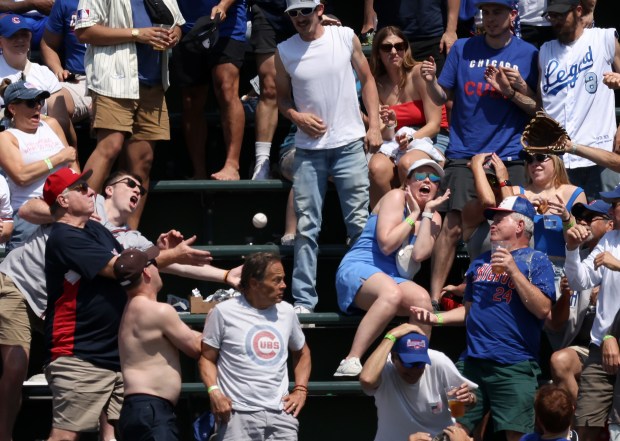 Fans watch a home run ball hit by Braves left fielder Jarred Kelenic land in the right field bleachers in the fifth inning against the Cubs at Wrigley Field on May 23, 2024. (John J. Kim/Chicago Tribune)