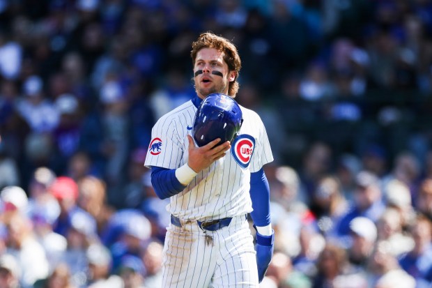 Cubs second base Nico Hoerner walks to the dugout after being tagged out at the plate against the Marlins on April 21, 2024, at Wrigley Field. (Eileen T. Meslar/Chicago Tribune)