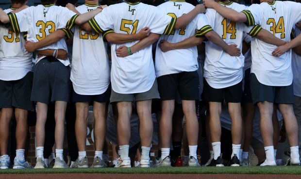 The Lane Tech College Prep High School baseball team is recognized as the 2024 Chicago Public Schools City Champions before a game between the Cubs and White Sox at Wrigley Field on June 5, 2024, in Chicago. (John J. Kim/Chicago Tribune)