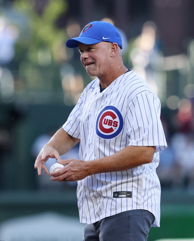 New DePaul men's basketball coach Chris Holtmann takes the mound to throw out a ceremonial first pitch before a game between the Cubs and White Sox at Wrigley Field on June 5, 2024, in Chicago. (John J. Kim/Chicago Tribune)