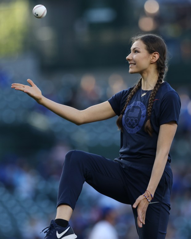 Olympic rhythmic gymnast Evita Griskenas takes the mound to throw out a ceremonial first pitch before a game between the Cubs and White Sox at Wrigley Field on June 5, 2024, in Chicago. (John J. Kim/Chicago Tribune)