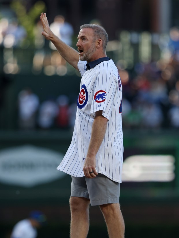 Former Cubs pitcher Ryan Dempster acknowledges fans before throwing out a ceremonial first pitch for a game between the Cubs and White Sox at Wrigley Field on June 5, 2024, in Chicago. (John J. Kim/Chicago Tribune)