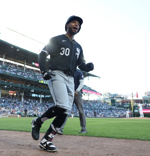 White Sox left fielder Corey Julks (30) heads to the dugout after hitting a home run on the first pitch of the game against the Cubs at Wrigley Field on June 5, 2024, in Chicago. (John J. Kim/Chicago Tribune)