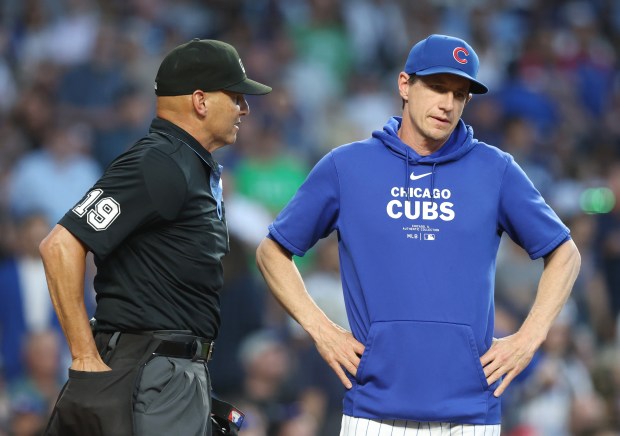 Cubs manager Craig Counsell argues a strikeout call on second baseman Nico Hoerner by umpire Vic Carapazza (19) in the fourth inning against the White Sox at Wrigley Field on June 5, 2024, in Chicago. (John J. Kim/Chicago Tribune)