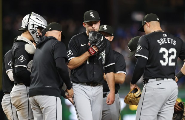 White Sox pitcher Jared Shuster, center, is taken out of the game in the seventh inning against the Cubs at Wrigley Field on June 5, 2024, in Chicago. It was the second pitching change of the inning by manager Pedro Grifol, center left. (John J. Kim/Chicago Tribune)