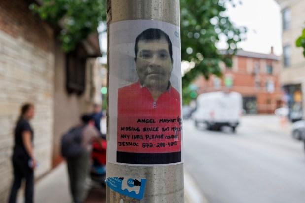 A photo of Angel Mashiant, 37, from Ecuador, is taped to a pole near a Mariano's in Lakeview where he went missing. Jessica Juma put the missing poster up of her husband.(Armando L. Sanchez/Chicago Tribune)