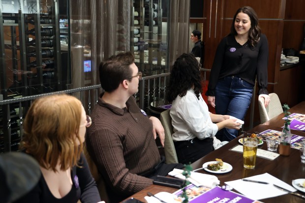 Dr. Paige Hackenberger, right, talks to colleagues at a victory party at Copper Fox restaurant in Chicago on Jan. 29, 2024, after Northwestern interns and residents voted to unionize. (Terrence Antonio James/Chicago Tribune)