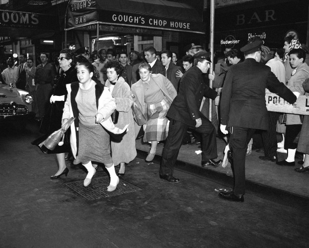 An overflow crowd is unable to gain entrance to Baker's Hall on Chicago's Near North Side on Sept. 23, 1949 during a concert appearance by singer Paul Robeson. A crowd of 1,200 heard the singer urge investigation of disorders, which accompanied his appearances in Peekskill, New York on Aug. 27 and Sept. 4. (Paul Cannon/AP)