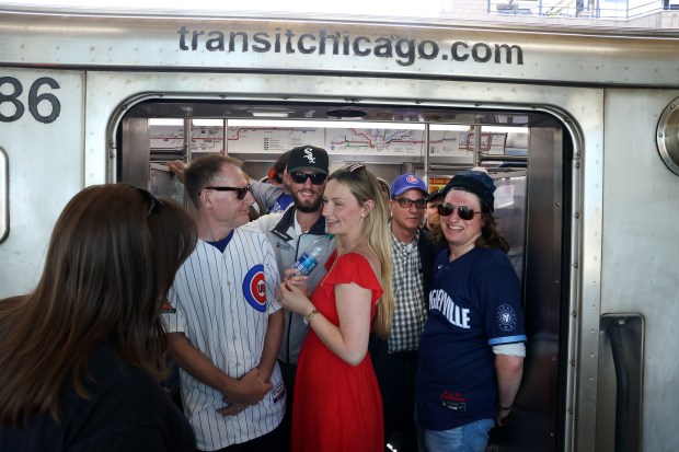 Both Cubs and Sox fans wait for doors to close on a CTA Red Line train at the Addison station as some fans travel to 35th Street to attend both Chicago Cubs and White Sox home games on May 23, 2024. (Chris Sweda/Chicago Tribune)