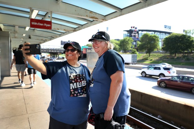 Rossy Martinez, left, and Julia Walker take a selfie at the 35th Street Red Line station as the best friends from Utah arrive from the Addison Street station in between attending both Chicago Cubs and White Sox home games on May 23, 2024. The two are attempting to see games in all major league ballparks. Thursday's Cubs game at Wrigley Field was their 15th major league park, with the White Sox at Guaranteed Rate, their 16th. (Chris Sweda/Chicago Tribune)