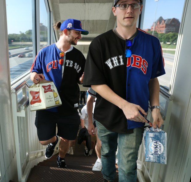 Eric Georgis, left, of Chicago's Humboldt Park neighborhood and Casey McAleer, of Lisle, attended both Cubs and White Sox home games on Thursday, using the CTA Red Line train to travel between Wrigley Field and Guaranteed Rate Field. (Chris Sweda/Chicago Tribune)