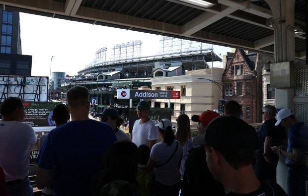 Baseball fans wait to board a southbound CTA Red Line train at Addison Street following a Cubs-Braves game on May 23, 2024. Some of those fans made the trip down to 35th Street to then attend the evening White Sox-Orioles game. (Chris Sweda/Chicago Tribune)