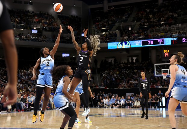 Connecticut Sun guard Tiffany Mitchell (3) shoots over Chicago Sky forward Michaela Onyenwere (12) in the second half of the Sky's home opener at Wintrust Arena in Chicago on May 25, 2024. (Chris Sweda/Chicago Tribune)