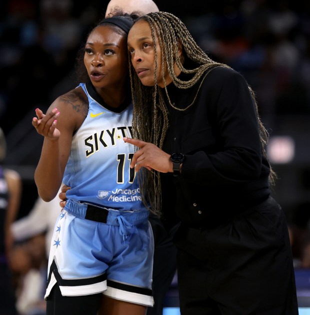 Chicago Sky head coach Teresa Weatherspoon talks with guard Dana Evans (11) during a break in the action in the second half of the Sky's home opener against the Connecticut Sun at Wintrust Arena in Chicago on May 25, 2024. (Chris Sweda/Chicago Tribune)