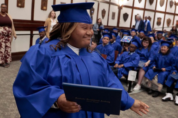 Southside Occupational Academy graduate Heaven Lockhart walks back to her seat after receiving her diploma during the graduation ceremony at Lindbloom Math and Science Academy on May 29, 2024. (Antonio Perez/Chicago Tribune)