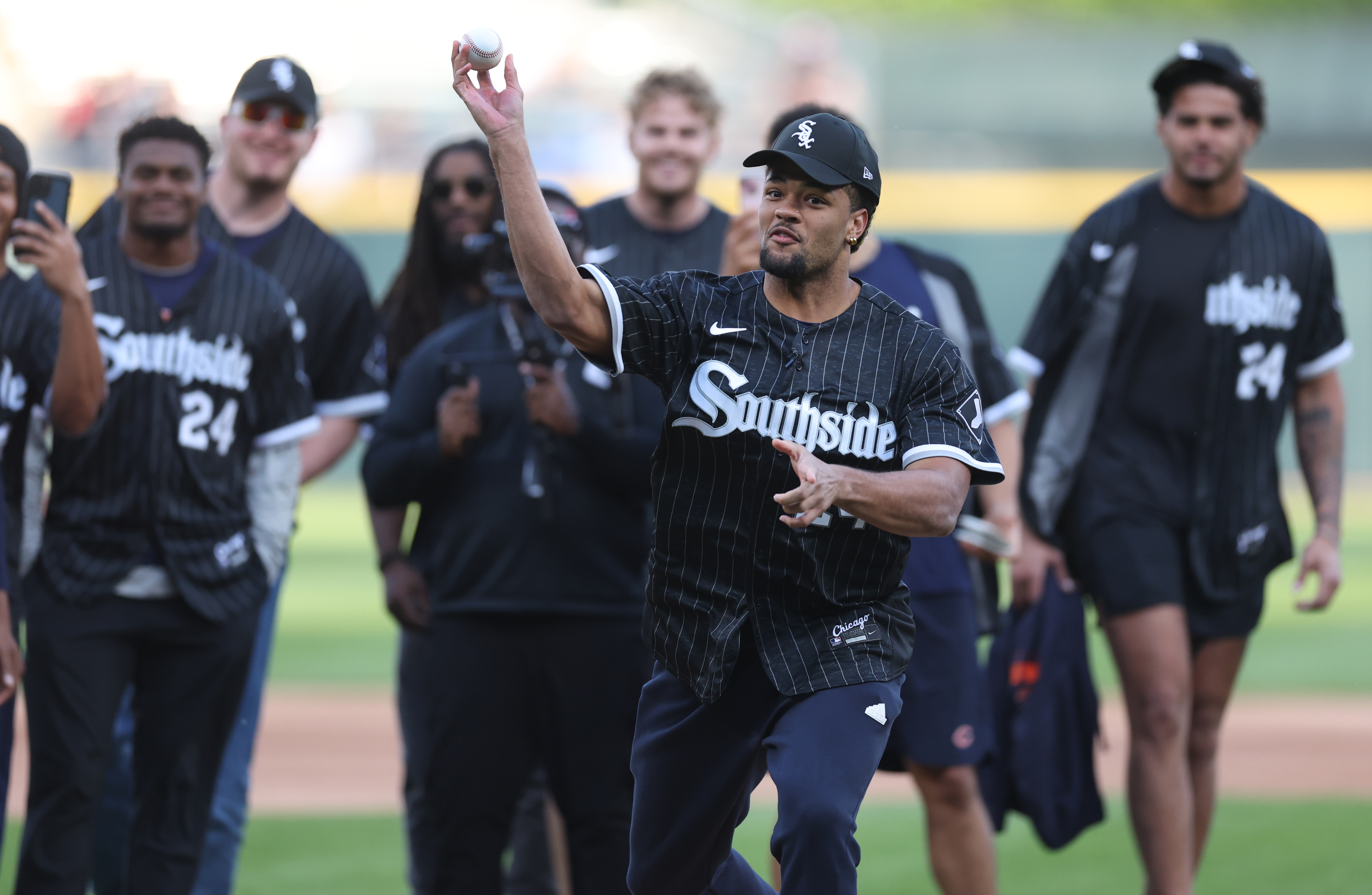 Chicago Bears rookies wide receiver Rome Odunze throws out a ceremonial first pitch before a game between the Chicago Cubs and the Baltimore Orioles at Guaranteed Rate Field in Chicago on May 23, 2024. (Chris Sweda/Chicago Tribune)