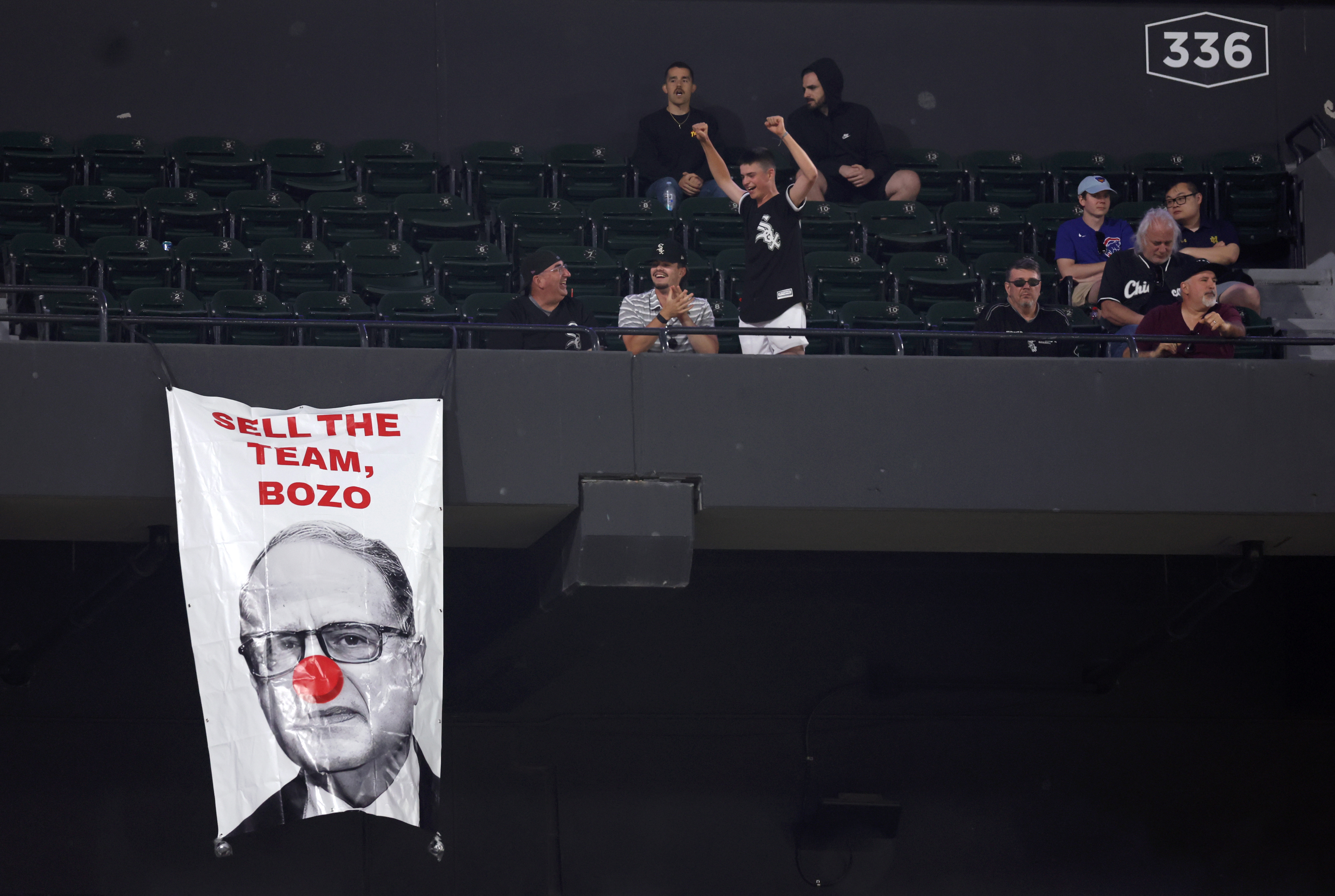 A sign depicting White Sox chairman Jerry Reinsdorf as Bozo the clown is seen hanging in the 300 level of Guaranteed Rate Field in Chicago in the ninth inning of a game between the Chicago White Sox and the Baltimore Orioles on May 23, 2024. (Chris Sweda/Chicago Tribune)