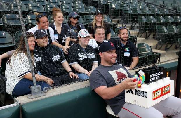 Red Sox reliever Liam Hendriks poses for a photograph with a group of cancer survivors before a game against the White Sox on June 6, 2024, at Guaranteed Rate Field. (Chris Sweda/Chicago Tribune)