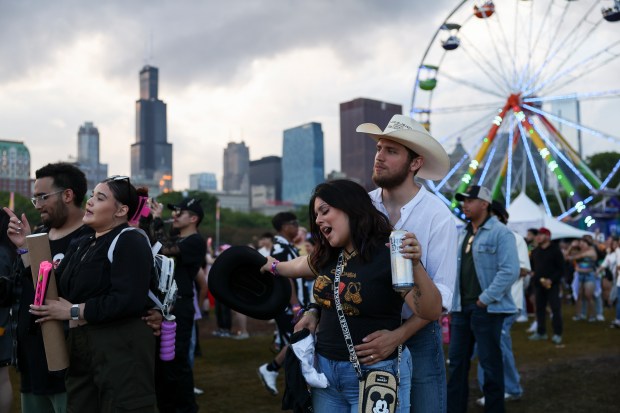 Isabella and Alexander Jenkinson dance to Maluma during the Sueños Festival at Grant Park on May 26, 2024. (Eileen T. Meslar/Chicago Tribune)