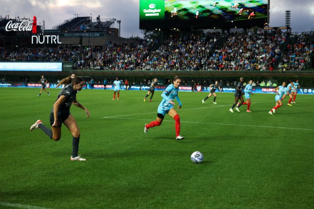 Chicago Red Stars defender Tatumn Milazzo (23) tries to stop Bay FC's Joelle Anderson during their game at Wrigley Field. (Eileen T. Meslar/Chicago Tribune)