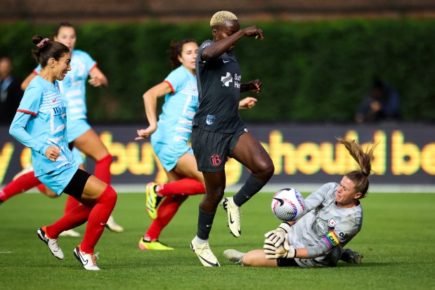 Chicago Red Stars goalkeeper Alyssa Naeher (1) tries to stop Bay FC's Racheal Kundananji during their game at Wrigley Field on June 8, 2024. (Eileen T. Meslar/Chicago Tribune)