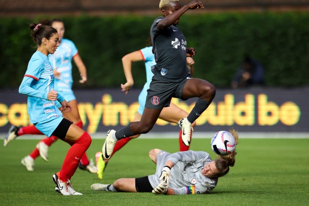 Chicago Red Stars goalkeeper Alyssa Naeher (1) tries to stop Bay FC's Racheal Kundananji during their game at Wrigley Field on June 8, 2024. (Eileen T. Meslar/Chicago Tribune)