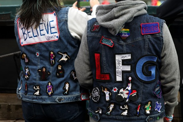 Cheryl and Clair Rollman-Tinajero sport vests with soccer patches as they watch the Chicago Red Stars warm up before their game against Bay FC at Wrigley Field on June 8, 2024. (Eileen T. Meslar/Chicago Tribune)