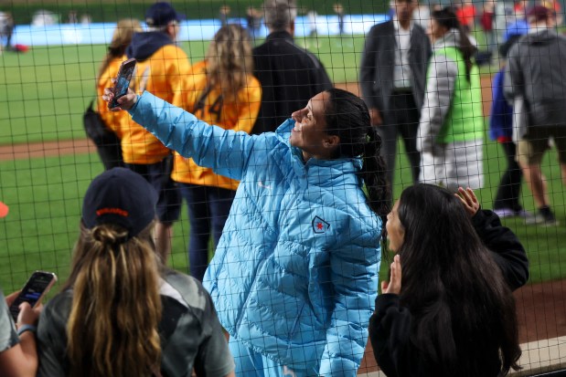 Chicago Red Stars midfielder Julia Bianchi poses for a selfie with fans after the Chicago Red Stars hosted Bay FC for a game at Wrigley Field on June 8, 2024. (Eileen T. Meslar/Chicago Tribune)