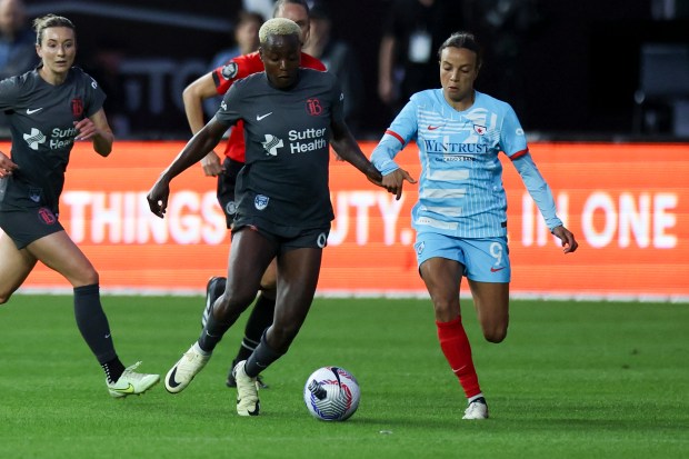 Chicago Red Stars forward Mallory Swanson (9) battles Bay FC's Racheal Kundananji for the ball during their game at Wrigley Field on June 8, 2024. (Eileen T. Meslar/Chicago Tribune)