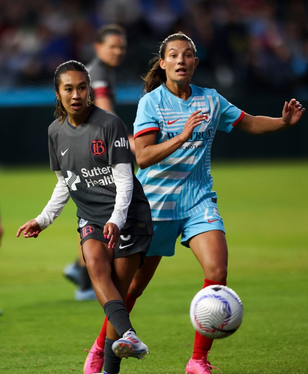 Chicago Red Stars forward Jenna Bike (24) battles Bay FC's Caprice Dydasco for the ball during their game at Wrigley Field on June 8, 2024. (Eileen T. Meslar/Chicago Tribune)