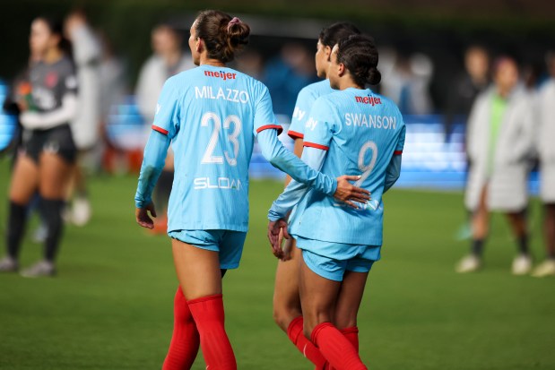 Chicago Red Stars defender Tatumn Milazzo (23) pats forward Mallory Swanson (9) on the back after losing to Bay FC at Wrigley Field on June 8, 2024. (Eileen T. Meslar/Chicago Tribune)