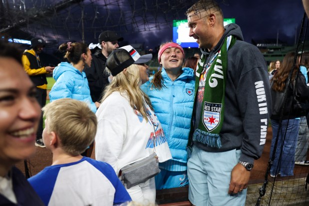 Chicago Red Stars forward Ally Schlegel hugs her parents after the Chicago Red Stars hosted Bay FC for a game at Wrigley Field on June 8, 2024. (Eileen T. Meslar/Chicago Tribune)