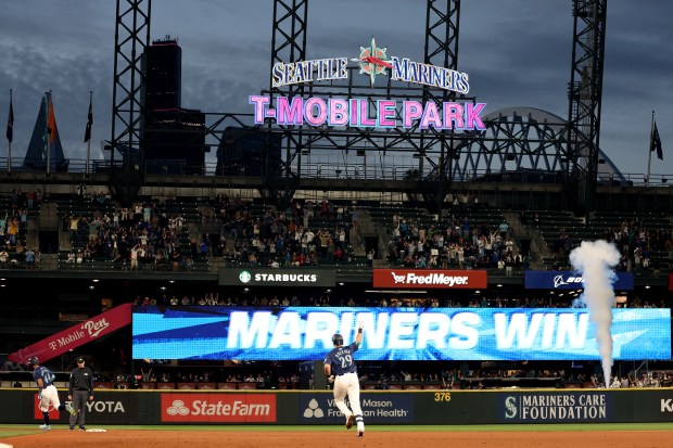 The Mariners' Cal Raleigh celebrates his walk-off grand slam to beat the White Sox on June 10, 2024, at T-Mobile Park in Seattle. (Steph Chambers/Getty Images)