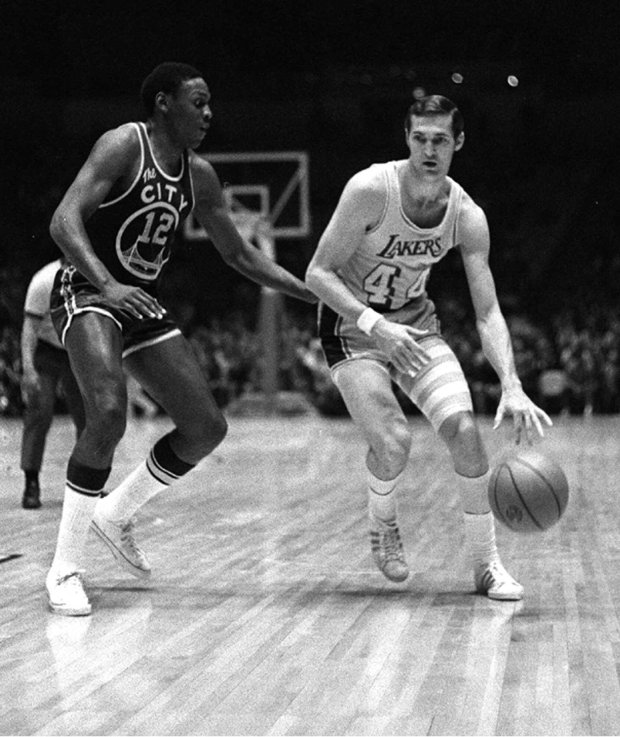 Lakers guard Jerry West drives the ball past the Warriors' Ron Williams March 11, 1970 in Los Angeles. (AP Photo/file)