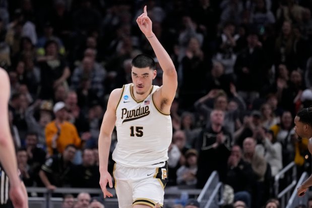 Purdue's Zach Edey celebrates after scoring in the NCAA Tournament against Utah State on Sunday, March 24, 2024 in Indianapolis. (AP Photo/Michael Conroy)