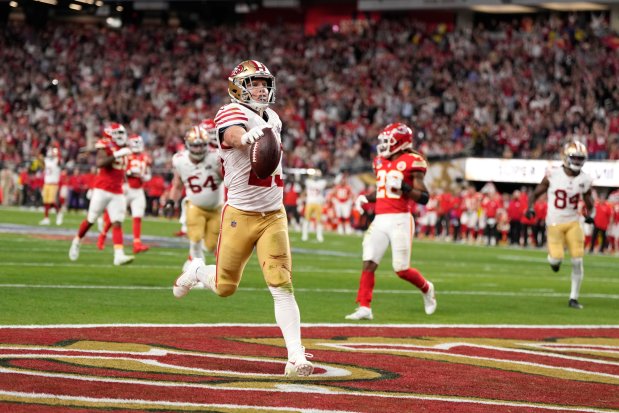 Running back Christian McCaffrey runs in a touchdown for the 49ers during the first half of the Super Bowl on Feb. 11, 2024, in Las Vegas. (AP Photo/Doug Benc)