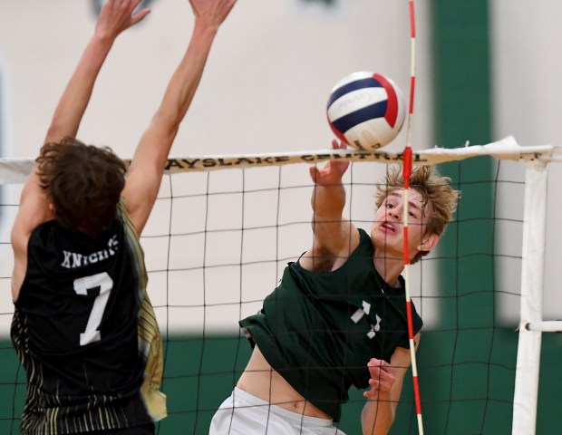 Grayslake North's Jack Calhoun (7) tries to block a slam from.Grayslake Central's George Hollenstein (11). Grayslake Central boys volleyball team defeated visitors Grayslake North 25-18, 25-21, Wednesday, May 1, 2024. (Rob Dicker/for the News Sun)